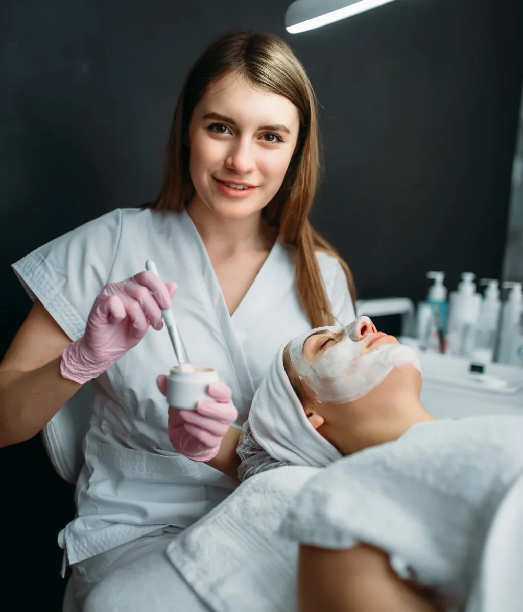 Female Doctor Holds Cream and Brush in Hands Female Doctor Holds Cream and Brush in Hands